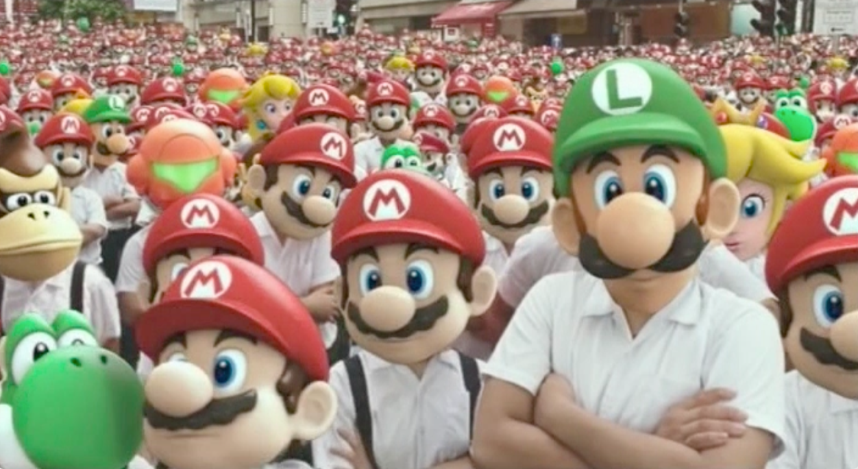 Still frame from the 2003 School's Out commercial, featuring hundreds of children with Nintendo character faces looking at the camera